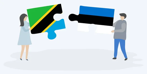 Paar Houden Twee Puzzels Stukken Met Tanzaniaanse Estse Vlaggen Tanzania — Stockvector