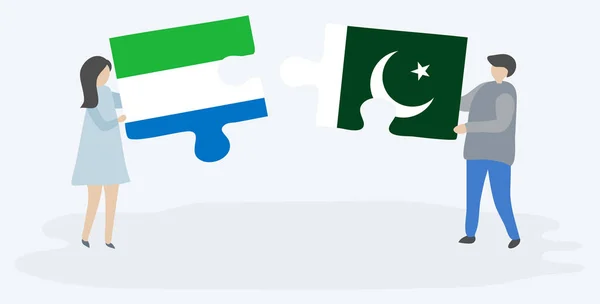 Pareja Sosteniendo Dos Piezas Rompecabezas Con Banderas Sierra Leona Pakistán — Archivo Imágenes Vectoriales
