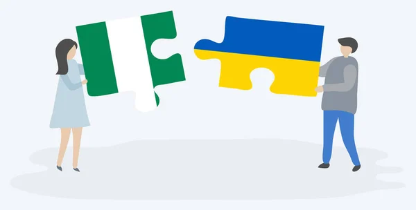 Pár Holding Két Rejtvények Darab Nigériai Ukrán Zászlók Nigéria Ukrajna — Stock Vector