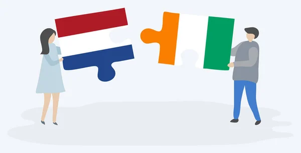Paar Mit Zwei Puzzleteilen Mit Holländischen Und Ivorischen Flaggen Niederlande — Stockvektor