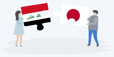 Irak ve Japon bayrakları ile iki bulmaca parçaları tutan çift. Irak ve Japonya ulusal sembolleri birlikte.