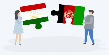 Tacikistani ve Afgan bayrakları ile iki bulmaca parçaları tutan çift. Tacikistan ve Afganistan ulusal sembolleri birlikte.