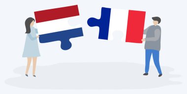 Hollanda ve Fransız bayrakları ile iki bulmaca parçaları tutan çift. Hollanda ve Fransa ulusal sembolleri birlikte.