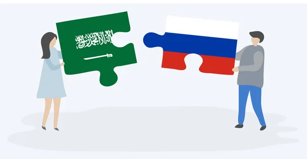 Para Trzymania Dwóch Puzzli Arabii Saudyjskiej Rosyjskich Flag Wspólne Symbole — Wektor stockowy