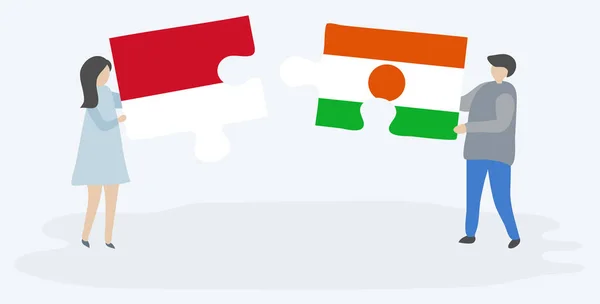 Paar Mit Zwei Puzzleteilen Mit Indonesischen Und Nigerianischen Flaggen Indonesien — Stockvektor