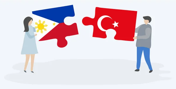 一对夫妇拿着两个拼图片与菲律宾和土耳其国旗 菲律宾和土耳其国家符号在一起 — 图库矢量图片