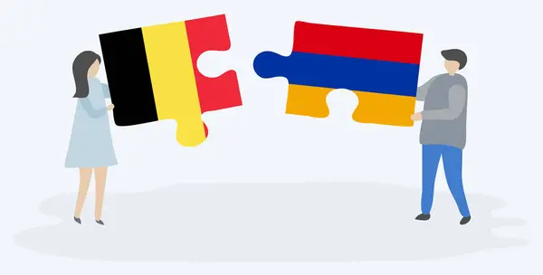 Para Trzyma Dwa Kawałki Puzzli Belgijskich Ormiańskich Flag Symbole Narodowe — Wektor stockowy