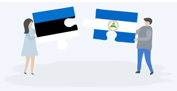 Couple Holding Two Puzzles Pieces Estonian Nicaraguan Flags Estonia Nicaragua — Stock Vector