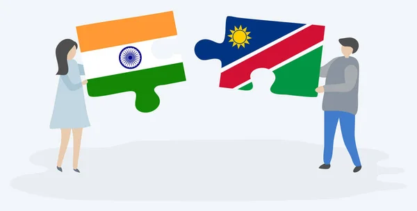 Pareja Sosteniendo Dos Piezas Rompecabezas Con Banderas Indias Namibias India — Vector de stock