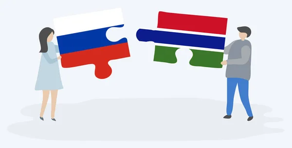 Paar Houden Twee Puzzels Stukken Met Russische Gambian Vlaggen Rusland — Stockvector