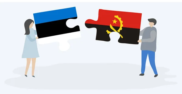 Para Trzyma Dwa Puzzle Kawałki Estońskim Angoli Flagi Estonia Angola — Wektor stockowy