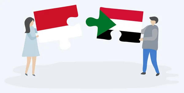 インドネシアとスーダンの旗を持つ2つのパズルピースを保持しているカップル インドネシアとスーダンのシンボル — ストックベクタ