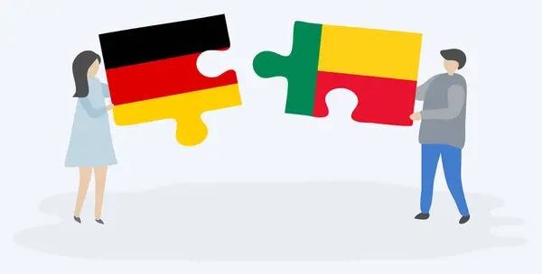 Casal Segurando Duas Peças Quebra Cabeças Com Bandeiras Alemãs Beninesas — Vetor de Stock