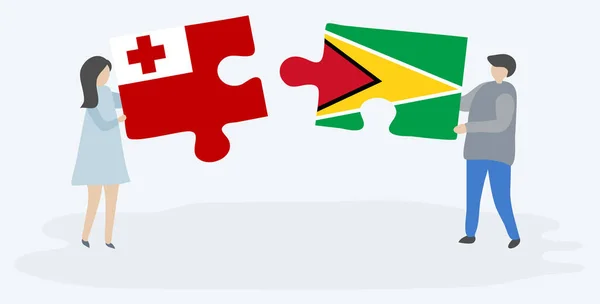 Para Trzyma Dwa Kawałki Puzzli Tongan Guyanese Flagi Symbole Narodowe — Wektor stockowy