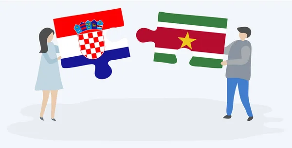 Pareja Sosteniendo Dos Piezas Rompecabezas Con Banderas Croatas Surinamesas Croacia — Vector de stock