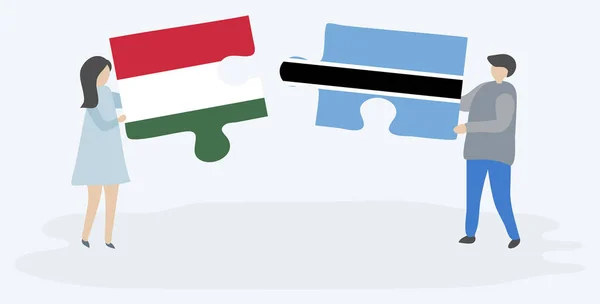 Pareja Sosteniendo Dos Piezas Rompecabezas Con Banderas Húngaras Motswana Hungría — Vector de stock