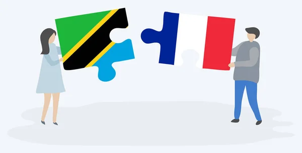 Pareja Sosteniendo Dos Piezas Rompecabezas Con Banderas Tanzania Francia Tanzania — Vector de stock