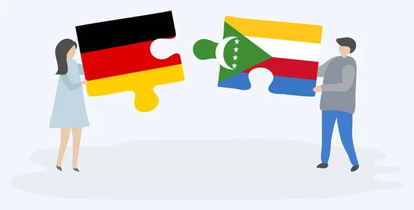 Couple Tenant Deux Pièces Puzzles Avec Des Drapeaux Allemands Comoriens — Image vectorielle