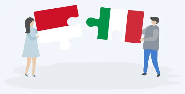 Pareja Sosteniendo Dos Piezas Rompecabezas Con Banderas Indonesia Italia Indonesia — Vector de stock