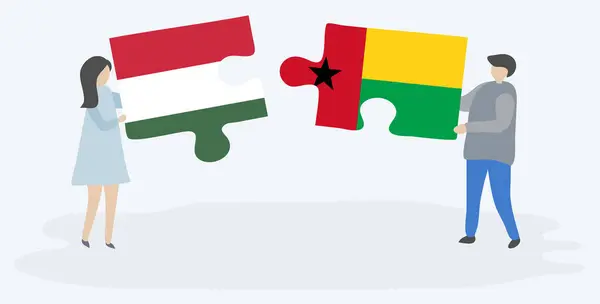 Par Som Holdt Puslespill Med Ungarske Bissau Guineanske Flagg Ungarn – stockvektor