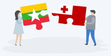 Çift Birmanya ve Tongan bayrakları ile iki bulmaca parçaları tutan. Myanmar ve Tonga ulusal sembolleri birlikte.