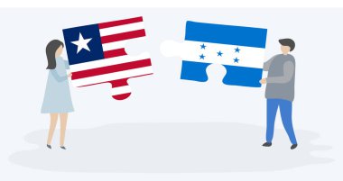 Liberya ve Honduras bayrakları ile iki bulmaca parçaları tutan çift. Liberya ve Honduras ulusal sembolleri birlikte.