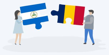 Nikaragua ve Chadian bayrakları ile iki bulmaca parçaları tutan çift. Nikaragua ve Çad ulusal sembolleri birlikte.