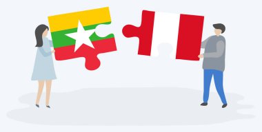 Birmanya ve Perulu bayrakları ile iki bulmaca parçaları tutan çift. Myanmar ve Peru ulusal sembolleri birlikte.
