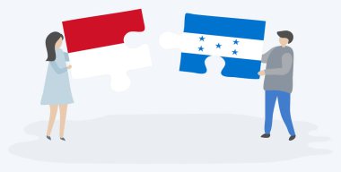 Monegasque ve Honduras bayrakları ile iki bulmaca parçaları tutan çift. Monako ve Honduras ulusal sembolleri birlikte.