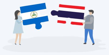 Nikaragua ve Tay bayrakları ile iki bulmaca parçaları tutan çift. Nikaragua ve Tayland ulusal sembolleri birlikte.