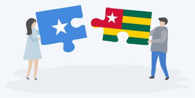 Çift, Somali ve Togo bayraklarıyla iki bulmaca parçası tutuyor. Somali ve Togo ulusal sembolleri birlikte.