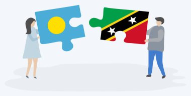 Palauan ve Kittitian bayrakları ile iki bulmaca parçaları tutan çift. Palau ve Saint Kitts ve Nevis ulusal sembolleri birlikte.