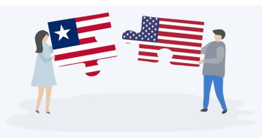 Liberya ve Amerikan bayrakları ile iki bulmaca parçaları tutan çift. Liberya ve Amerika Birleşik Devletleri ulusal semboller i.