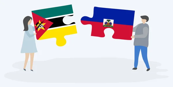 Paar Houden Twee Puzzels Stukken Met Mozambican Haïtiaanse Vlaggen Mozambique — Stockvector