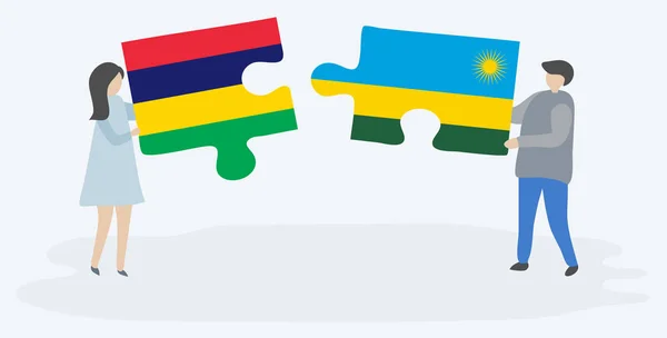 一对夫妇拿着两块拼图 上面挂着毛里求斯和卢旺达国旗 毛里求斯和卢旺达国家符号在一起 — 图库矢量图片