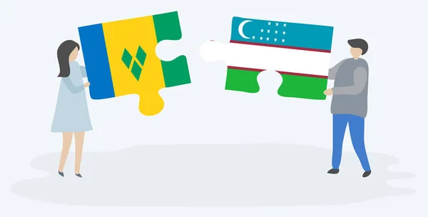 一对夫妇拿着两块拼图 上面挂着文森特和乌兹别克国旗 圣文森特和格林纳丁斯和乌兹别克斯坦国家象征在一起 — 图库矢量图片