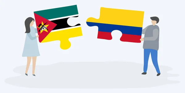 Couple Tenant Deux Pièces Puzzles Avec Des Drapeaux Mozambicains Colombiens — Image vectorielle