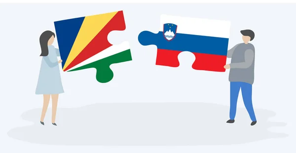 Seychellois Sloven Bayrakları Ile Iki Bulmaca Parçaları Tutan Çift Seyşeller — Stok Vektör
