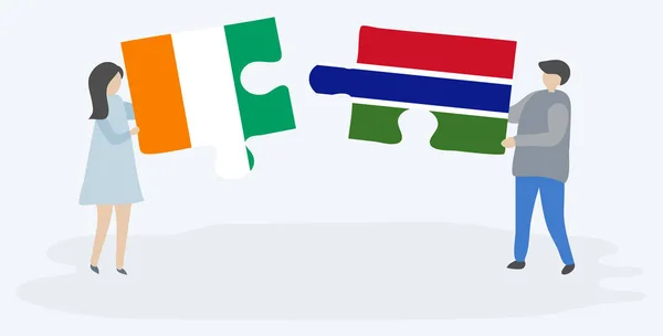 Paar Mit Zwei Puzzleteilen Mit Ivorischen Und Gambischen Flaggen Elfenbeinküste — Stockvektor
