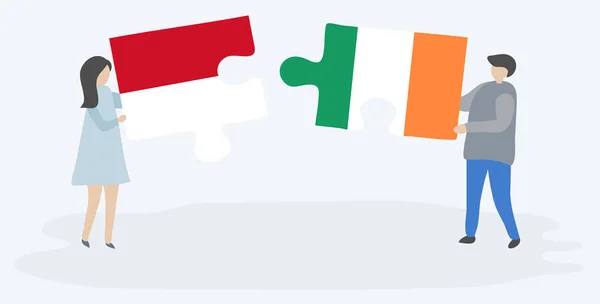 Para Trzyma Dwa Kawałki Puzzli Monako Irlandzkich Flag Symbole Narodowe — Wektor stockowy