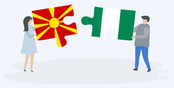 Casal Segurando Duas Peças Quebra Cabeças Com Bandeiras Macedônia Nigeriana —  Vetores de Stock