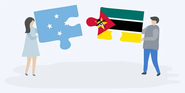 Couple Tenant Deux Pièces Puzzles Avec Des Drapeaux Micronésiens Mozambicains — Image vectorielle