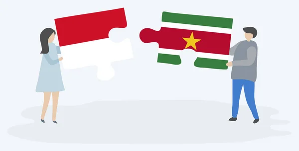 Pareja Sosteniendo Dos Piezas Rompecabezas Con Banderas Monegascas Surinamesas Mónaco — Vector de stock