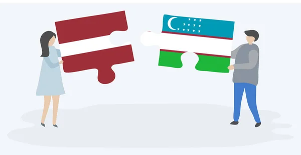 一对夫妇拿着两块带有拉脱维亚和乌兹别克国旗的拼图 拉脱维亚和乌兹别克斯坦国家符号在一起 — 图库矢量图片