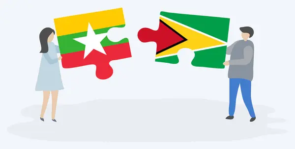 Пара Держащая Две Головоломки Бирманскими Гайанскими Флагами Мьянма Гайана Вместе — стоковый вектор