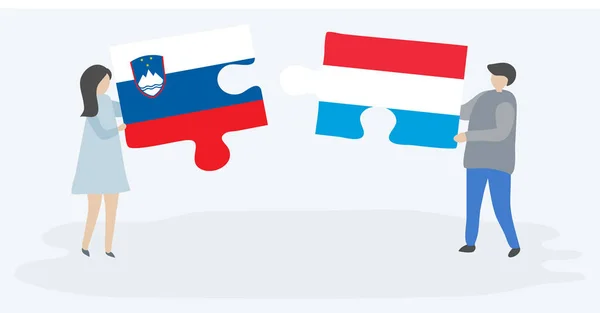 Ζευγάρι Που Κατέχει Δύο Κομμάτια Παζλ Σλοβενικές Και Λουξεμβουργιανή Σημαίες — Διανυσματικό Αρχείο
