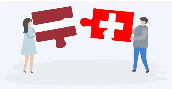 一对夫妇拿着两个拼图片与拉脱维亚和瑞士国旗 拉脱维亚和瑞士国家符号在一起 — 图库矢量图片