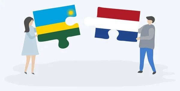 Couple Tenant Deux Pièces Puzzles Avec Des Drapeaux Rwandais Néerlandais — Image vectorielle