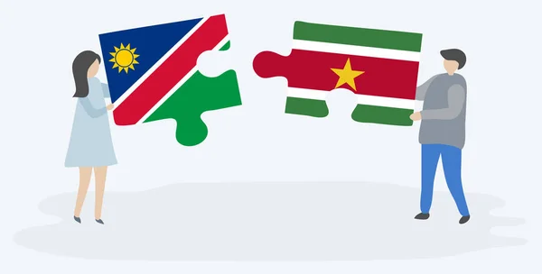Pareja Sosteniendo Dos Piezas Rompecabezas Con Banderas Namibia Suriname Namibia — Vector de stock