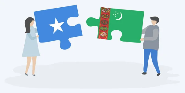 ソマリアとトルクメンの旗を持つ2つのパズルピースを持つカップル ソマリアとトルクメニスタンの国のシンボル — ストックベクタ